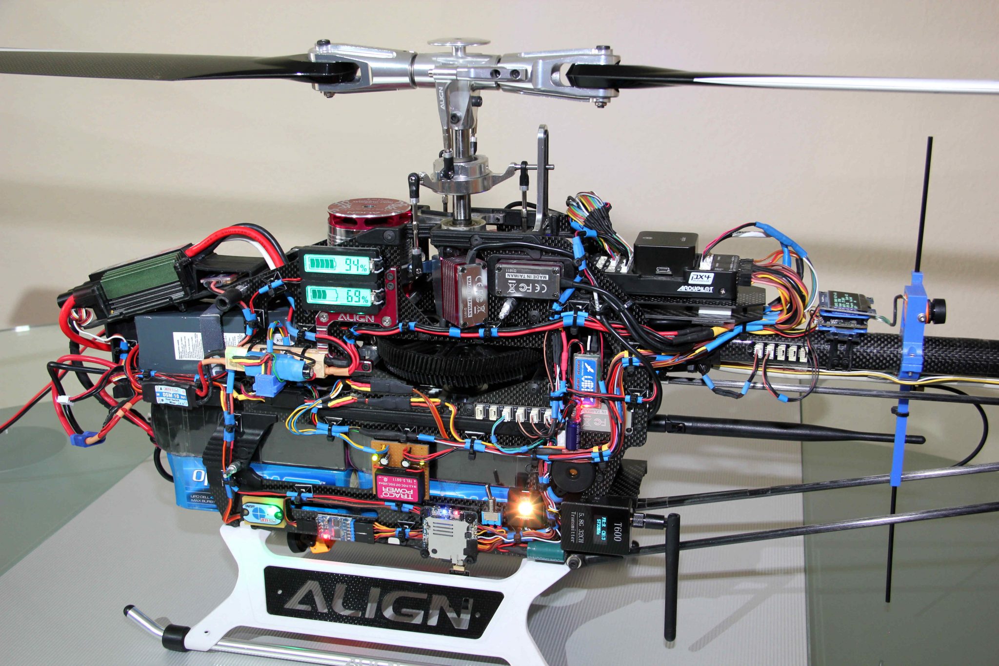 Electronic systems of a fully autonomous UAV helicopter: T-Rex 800 with ArduPilot flight controller, Pixhawk 2.1 Cube Black, redundant power supply, cabling, video transmission; measuring helicopter for free-flight experiments